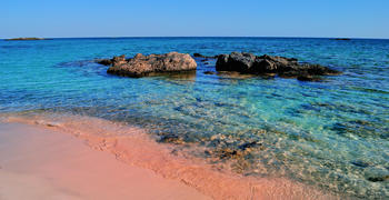 a rocky beach next to a body of water