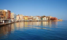 a small boat in a harbor next to a body of water