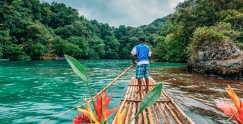 a group of people on a boat in the water