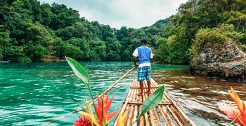 a person standing on a boat in the water