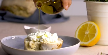 a bowl of food on a plate on a table