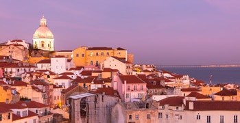 a city with buildings and a body of water